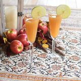 Two apple cocktails in fluted glasses.