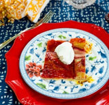 Simple rustic fruit tart on a colorful place setting