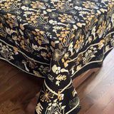 Mushroom patterned tablecloth on a wooden surface