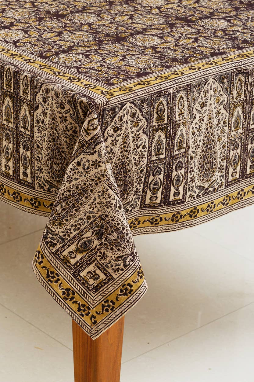 Decorative tablecloth with intricate patterns on a white surface