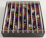 Colorful beaded bracelets with skull designs in a box