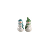 Two small snowman figurines with green hats and scarves on a white background