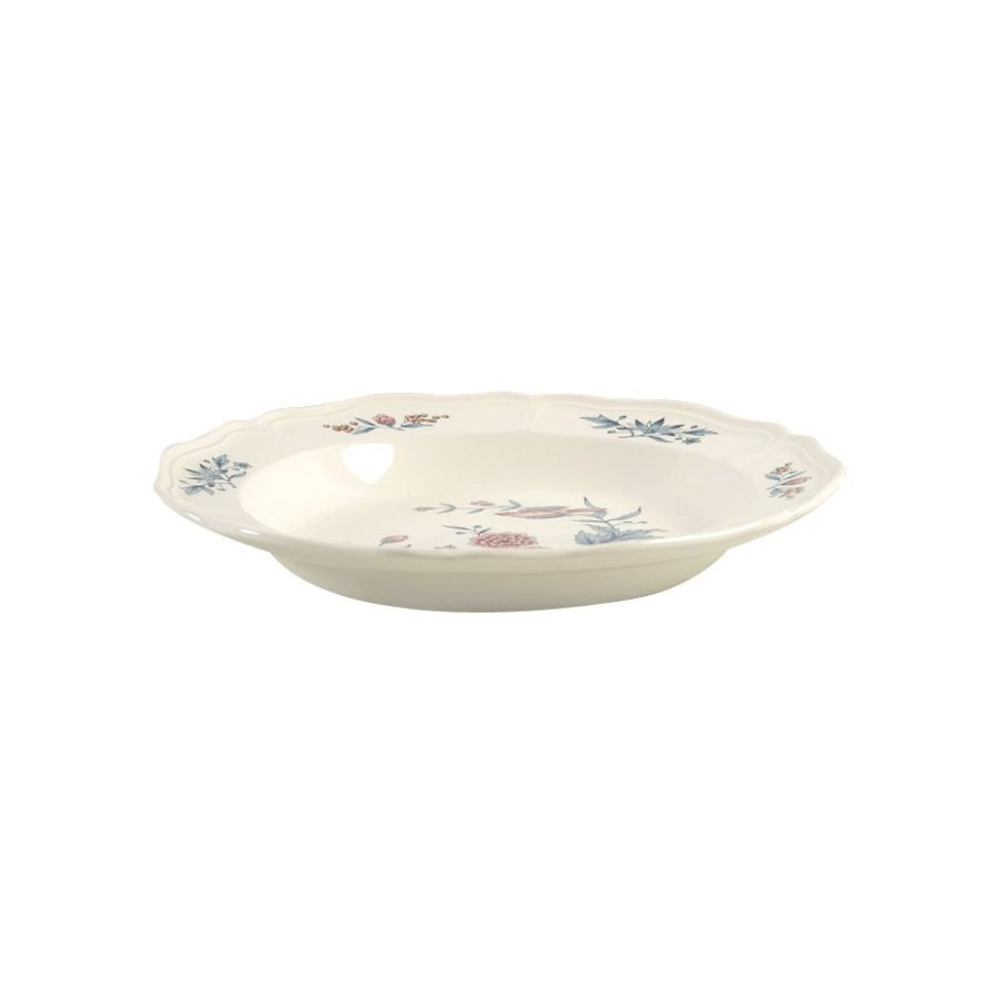 Ceramic bowl with floral patterns on a cream background