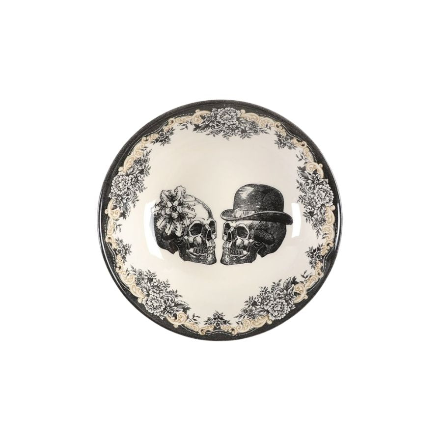 Decorative plate with pair of skulls in festive hats on a white background