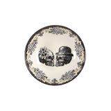 Decorative plate with pair of skulls in festive hats on a white background