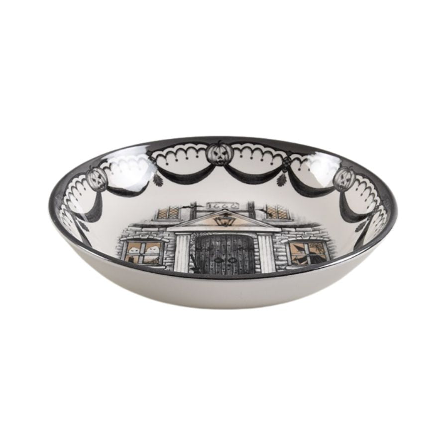 Decorative bowl with architectural design on a white background