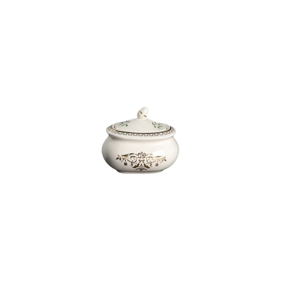 Decorative silver sugar bowl with lid on a white background