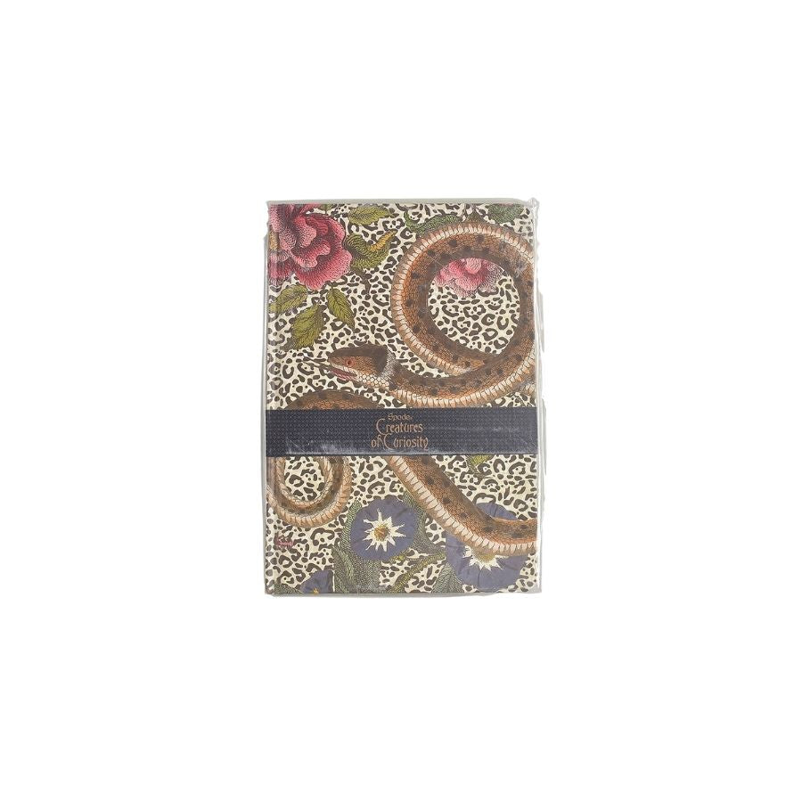 Notebook with floral and paisley design on a white background