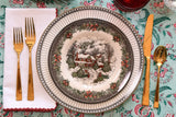 Holiday place setting in black, red, and green