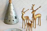 Metal tree and gold reindeer figurines