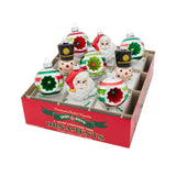 A box of Christmas ornaments  in various shapes in a box on a white background