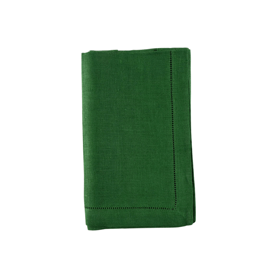 Folded green napkin on a white background