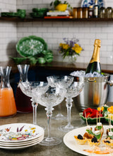 Ready to party with gorgeous crystal coupes, pretty plates, and delicate nibbles.