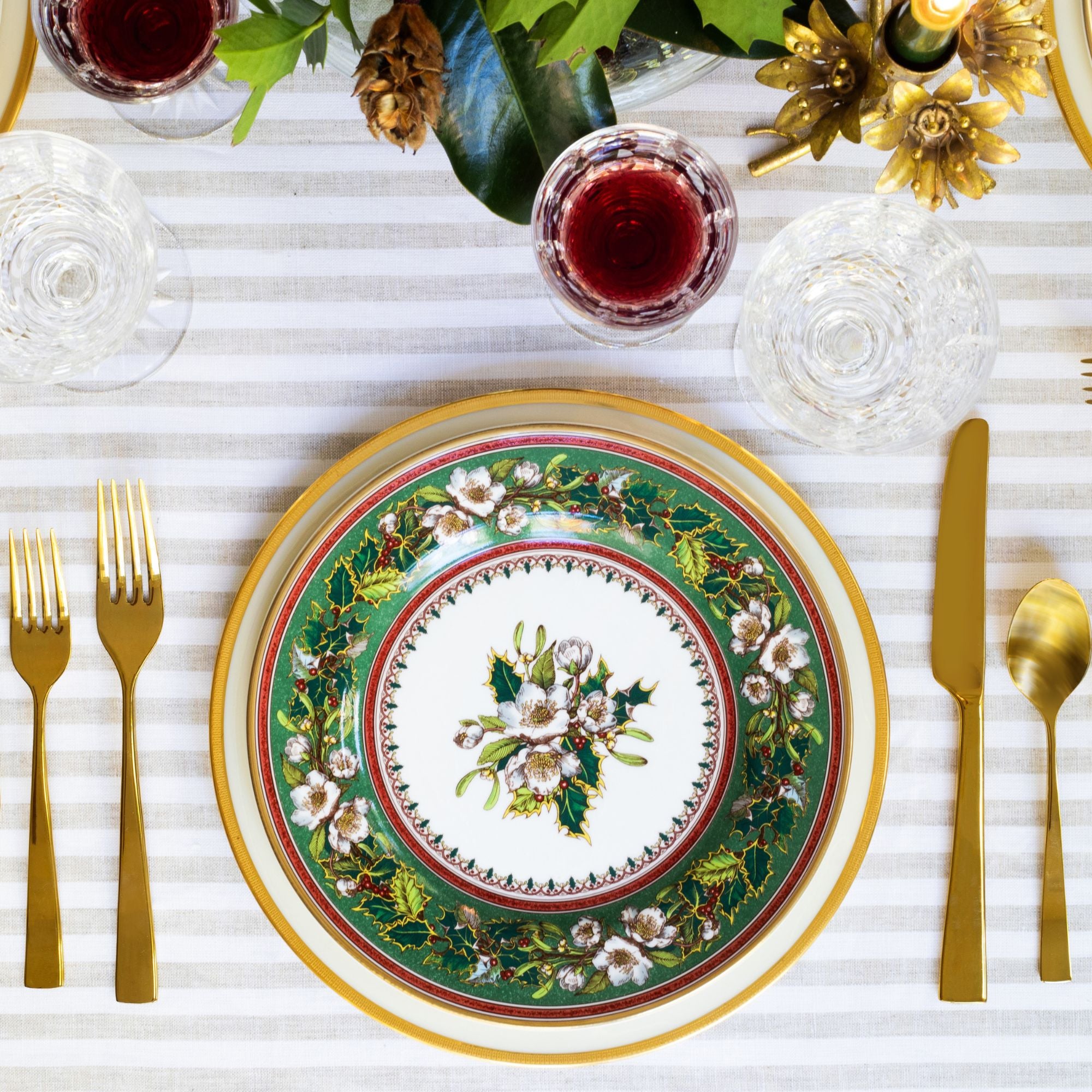 The Holly Rose place setting is resplendent in gold and jewel tones.