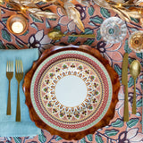 Colorful Imari Winter Fire table setting with crystal and flatware.
