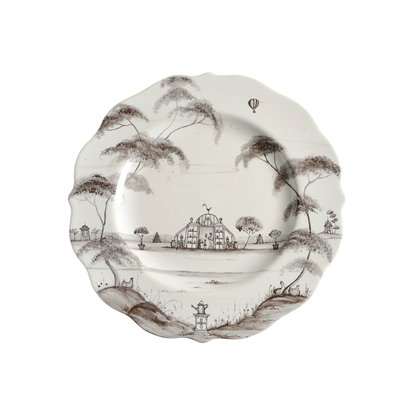 Decorative plate depicting a greenhouse in a garden in black.
