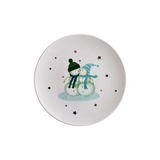 Decorative plate with snowman design on a white background with golden stars.