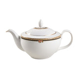 White teapot with gold accents on a white background