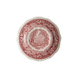 Decorative plate with red and white pattern on a white background