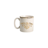 White mug with gold decorative pattern on a white background