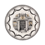 Decorative plate with a haunted house design on a white background
