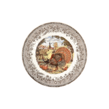 Salad plate with a turkey and pumpkins scene in a brown floral border.