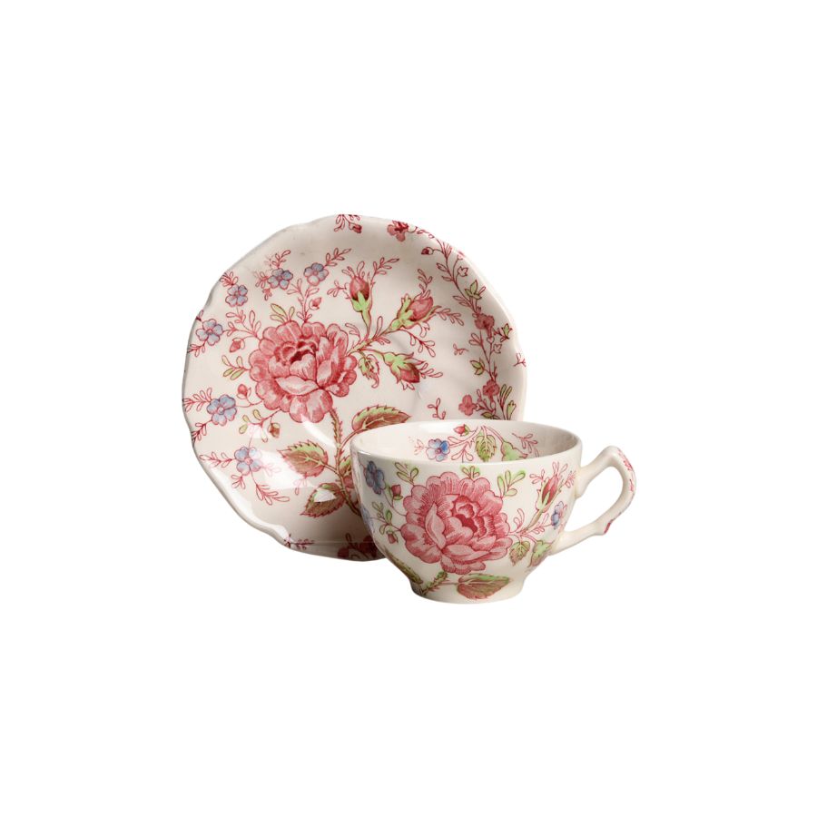 Cup and saucer with roses and floral designs.