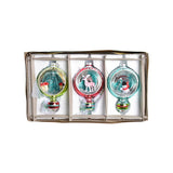 Christmas ornaments featuring miniature scenes in a box on a white background.