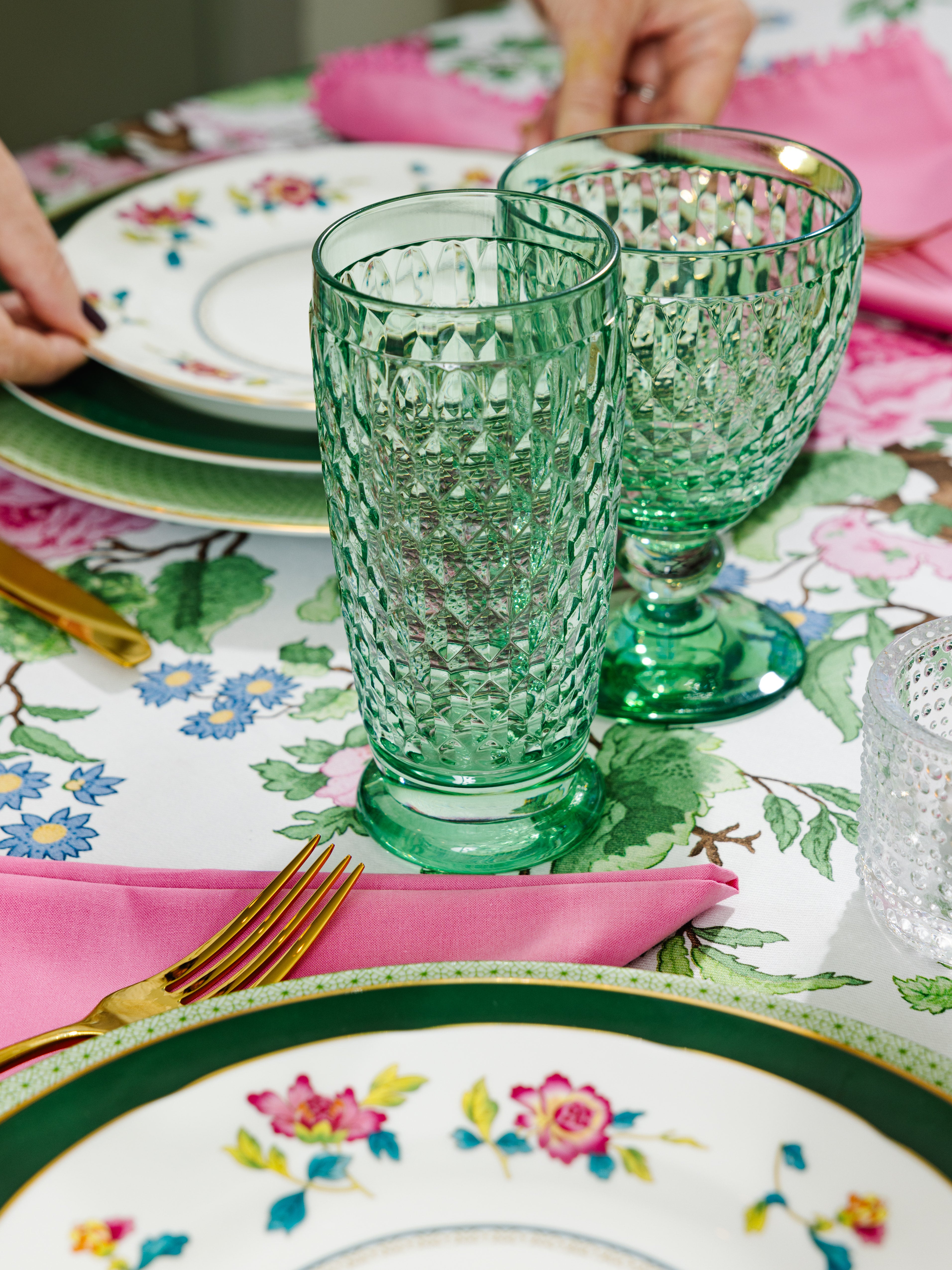 Boston Green glassware lends color and sparkle to a pink and green table.