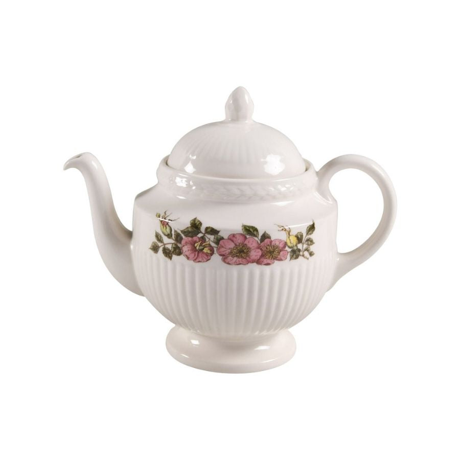 White teapot with floral design on a white background