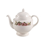 White teapot with floral design on a white background