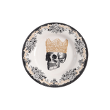 Decorative plate depicting florals and a skull wearing a crown in profile.