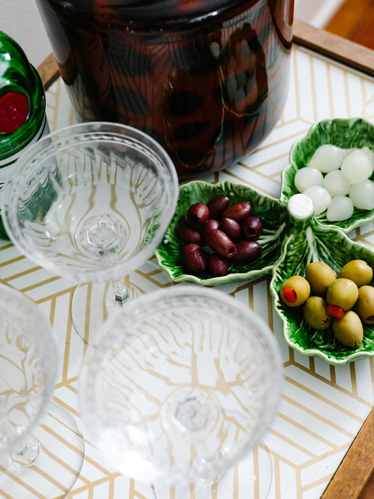 Stemware arranged on a bar cart.