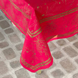 Red fabric with gold patterns on a stone pavement